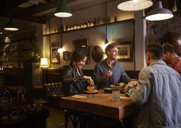 Friends enjoying food and drinks at Mr. Watkin's Bar in Penrith, Sydney West