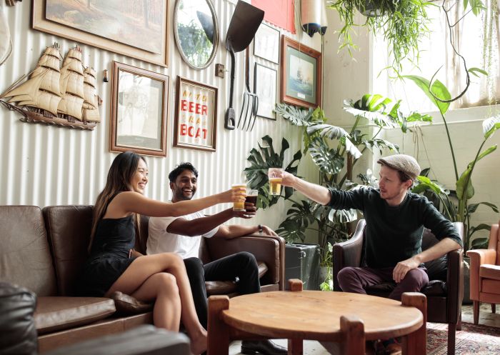 Friends enjoying beers at Willie The Boatman in St. Peters, Inner Sydney