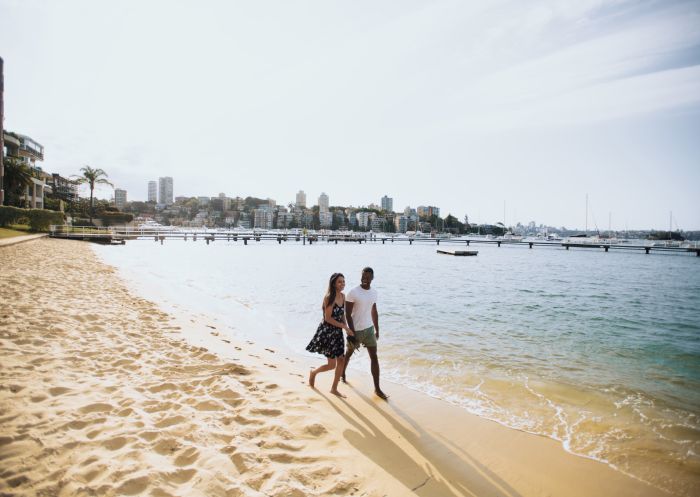 Couple enjoying a walk by Murray Rose Pool in Double Bay, Sydney East