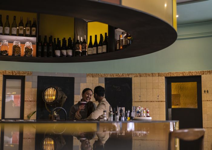 Couple enjoying a drink at The Old Clare Hotel in Chippendale, Inner Sydney