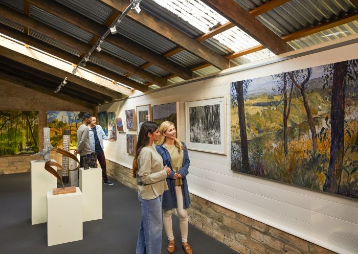 Visitors viewing artwork at Purple Noon Gallery, Freemans Reach