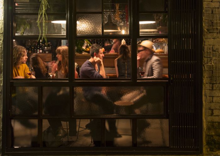 People enjoying drinks at Love Tilly Devine, Darlinghurst