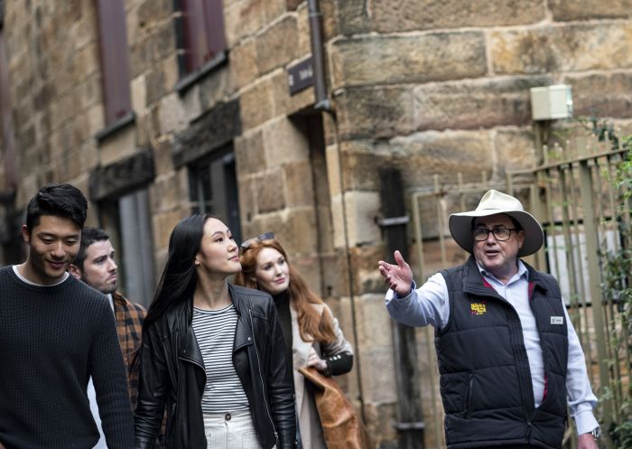 Group enjoying a historical tour of The Rocks with The Rocks Walking Tour company in Sydney