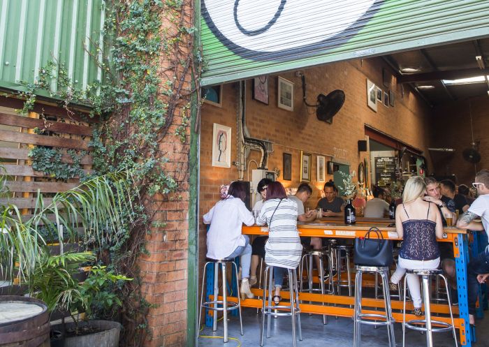 Patrons outside enjoying the beer at Young Henrys bar and brewery, Newtown