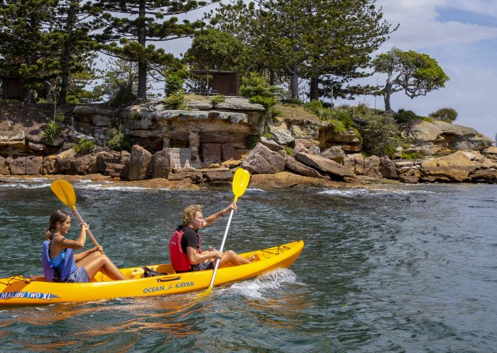 Couple enjoying a day of kayaking on Sydney Harbour