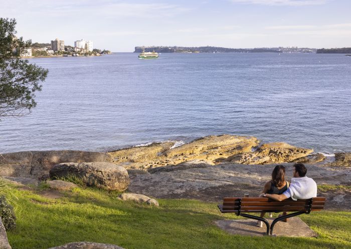 Couple enjoying scenic views across North Harbour from Fairlight Walk, Manly
