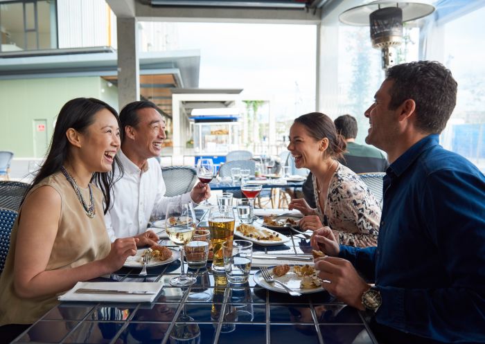 Friends enjoying food and drink at Turkish restaurant Anason in Barangaroo, Sydney City