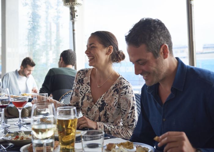 Couple enjoying food and drink at Turkish restaurant Anason in Barangaroo, Sydney City