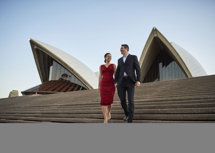 Couple enjoying an evening out at Sydney Opera House in Circular Quay, Sydney City