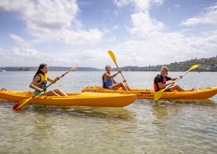Friends enjoying a day of kayaking on Sydney Harbour, Sydney City