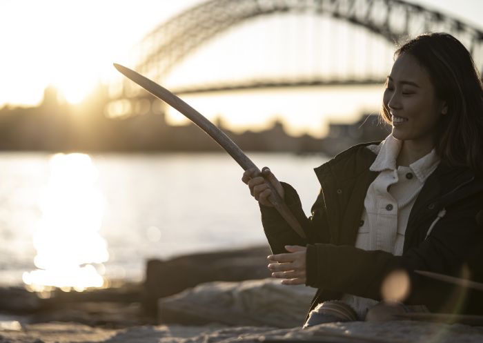 Woman learning about Aboriginal culture on a tour with Aboriginal Cultural Tours, Barangaroo Reserve