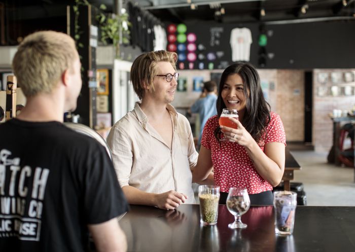 Couple ordering beers at Small Batch by Batch Brewing Co., Petersham