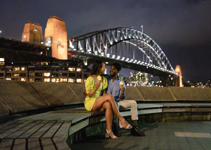 Couple enjoying an ice-cream at Campbells Cove Lookout, Sydney Harbour