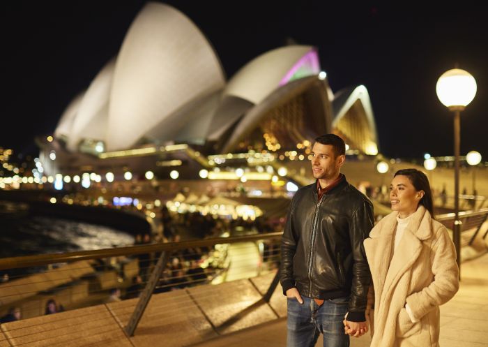 Couple enjoying an evening walking around Sydney Harbour, Sydney City