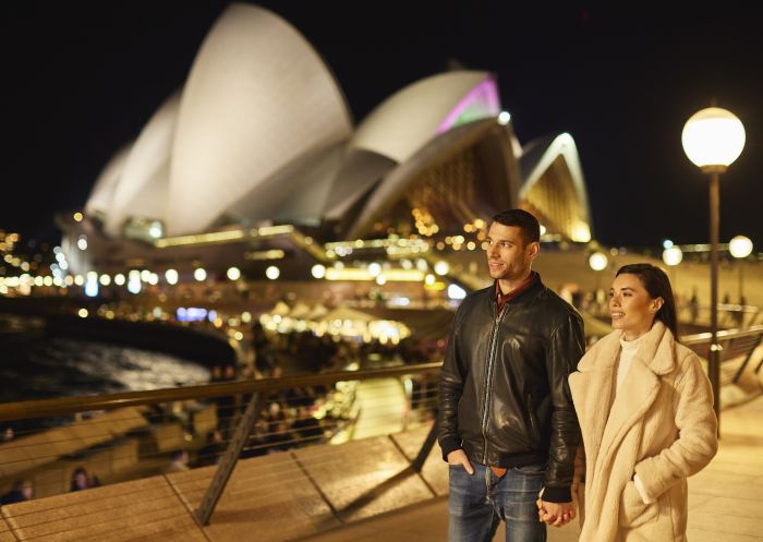Couple enjoying an evening walking around Sydney Harbour, Sydney City