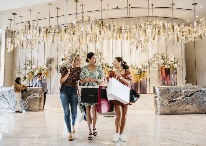 Friends returning to Crown Sydney after a day of shopping in Barangaroo, Sydney City