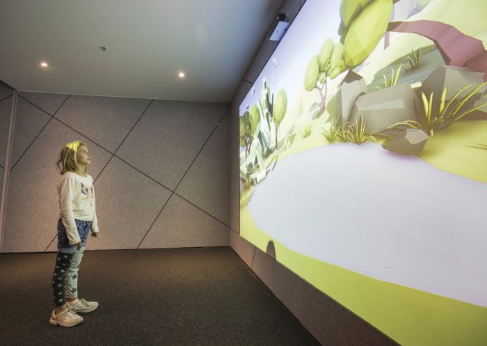 Girl embarking on a quest at Virtual Reality: The Quest, held at the Powerhouse Museum