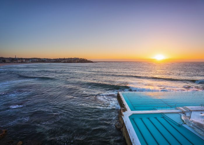 Morning sun rising over Bondi Icebergs, Bondi Beach