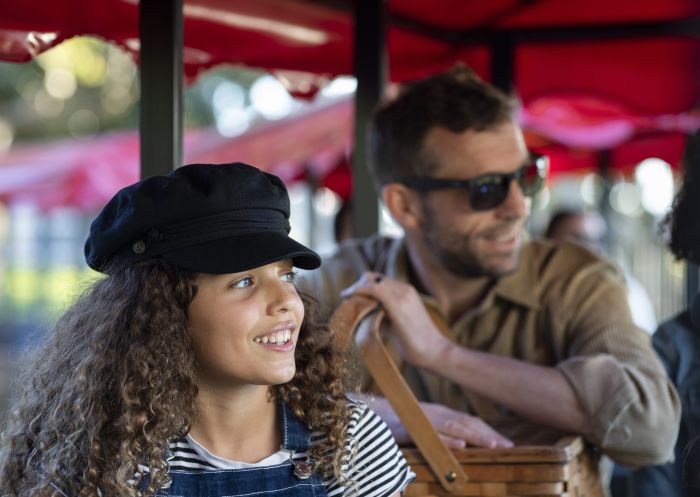 Family enjoying a ride on the Choo Choo Express in the Royal Botanic Garden Sydney