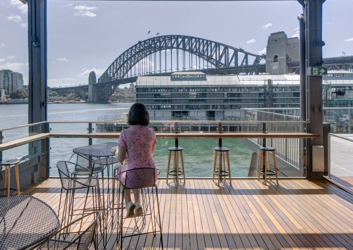 The Theatre Bar, Sydney Theatre Company Woman enjoying view from Bar at Sydney Theatre Company in Walsh Bay, Sydney City