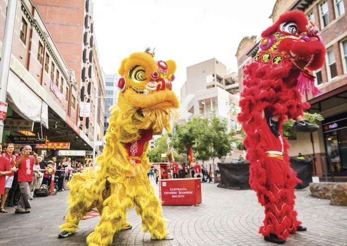 Dragon and lion dancer performing in Chinatown, Sydney during Chinese New Year 2018