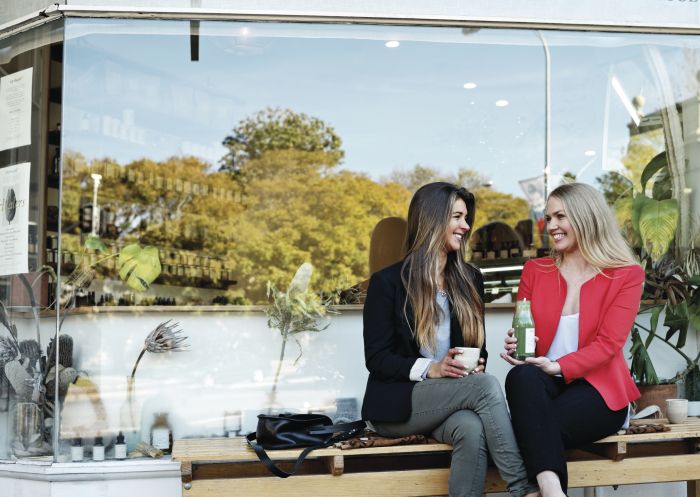 Friends catching up for coffee and drink at Orchard St Raw Takeaway, Paddington