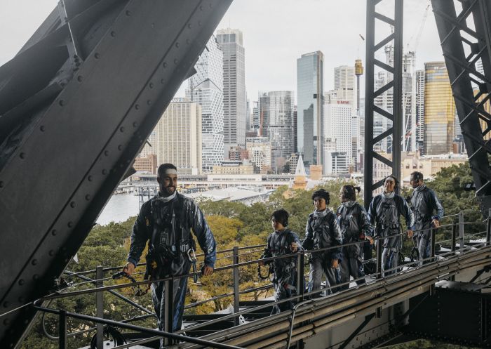 Family enjoying the Burrawa Indigenous Experience at BridgeClimb, Sydney