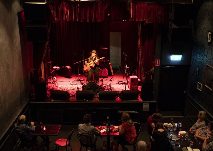 Patrons enjoying drinks and live music at The Vanguard, Newtown in Sydney's inner west.