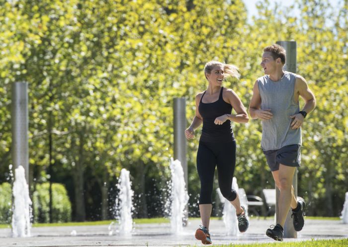 Couple running at Sydney Olympic Park, Sydney West