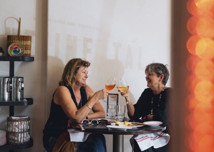 People enjoying food and drink at Continental Deli Bar Bistro in Newtown, Inner Sydney