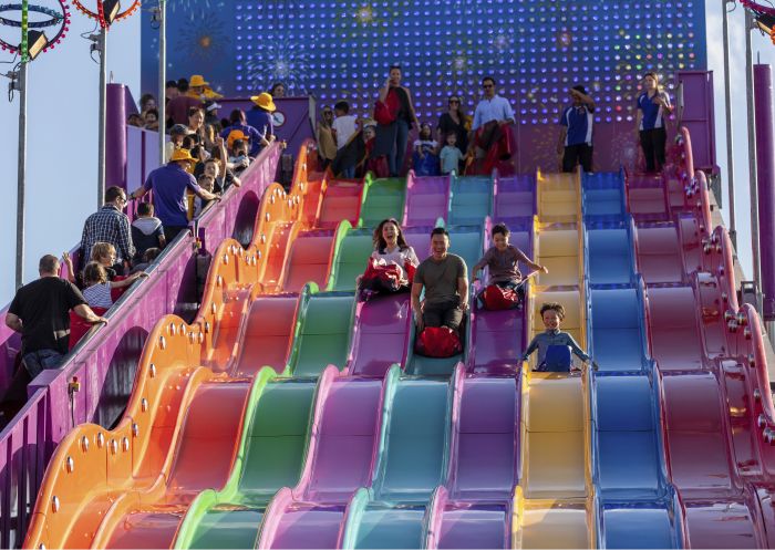 Family enjoying the carnival rides at the 2019 Sydney Royal Easter Show, Sydney Showground at Sydney Olympic Park