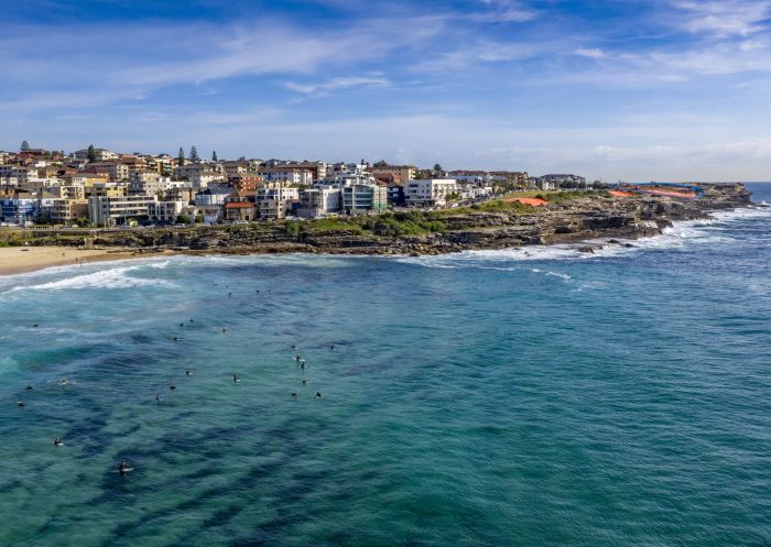 Surfers waiting to catch the next wave off Maroubra Beach, Maroubra