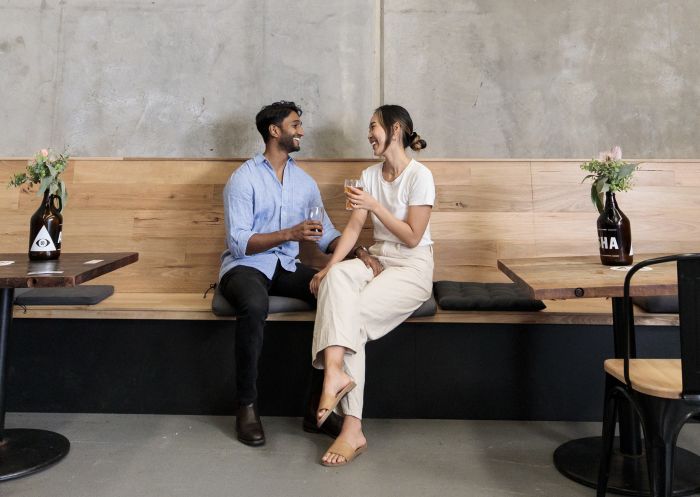 Couple enjoying beers at Akasha Brewing Company in Five Dock, Inner Sydney