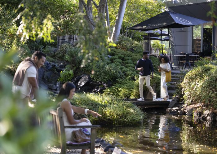 Visitors enjoying the Japanese Garden inside the Campbelltown Arts Centre in Campbelltown, Sydney West