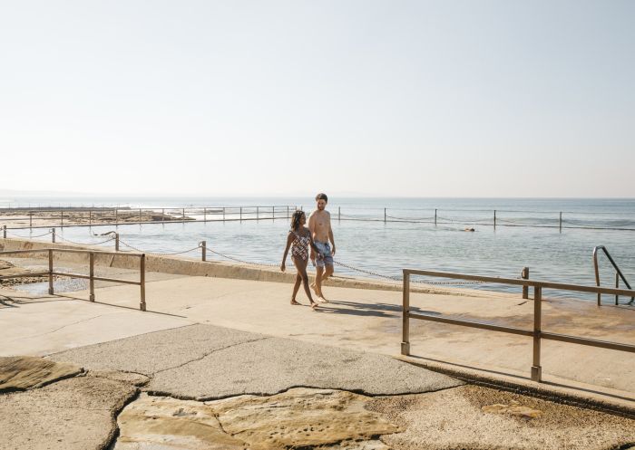 Couple enjoying a day in the sun at Cronulla Rock Pool, Cronulla