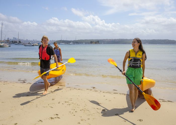 Friends enjoying a day of kayaking on Sydney Harbour