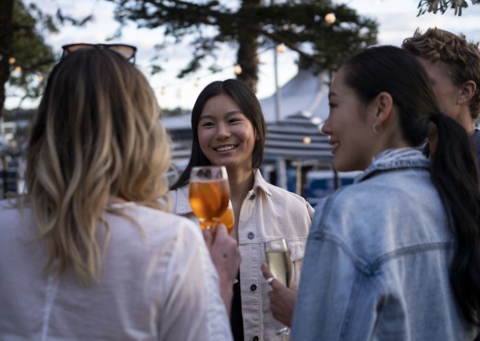 Friends enjoying a sunset drink at Watsons Bay Boutique Hotel's Beach Club, Watsons Bay