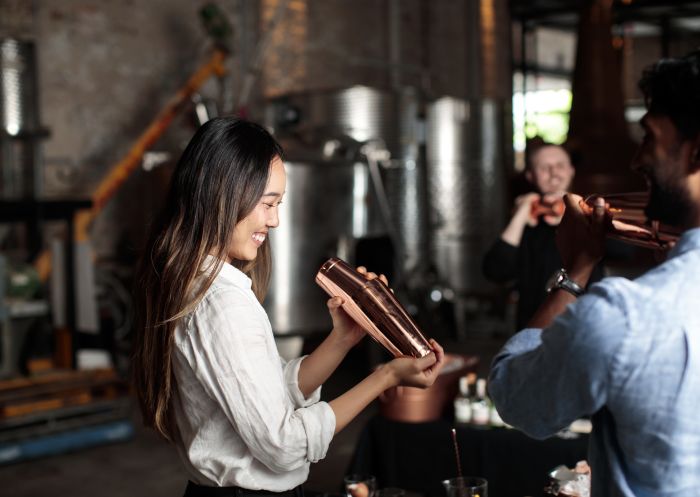 Couple enjoying a cocktail masterclass experience at Archie Rose Distilling Co., Rosebery