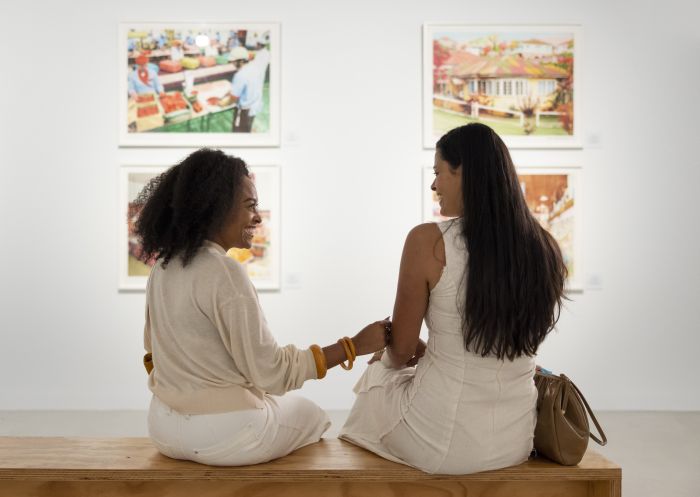 Visitors enjoying the Recent Acquisitions exhibition on at the Campbelltown Arts Centre, Cambelltown