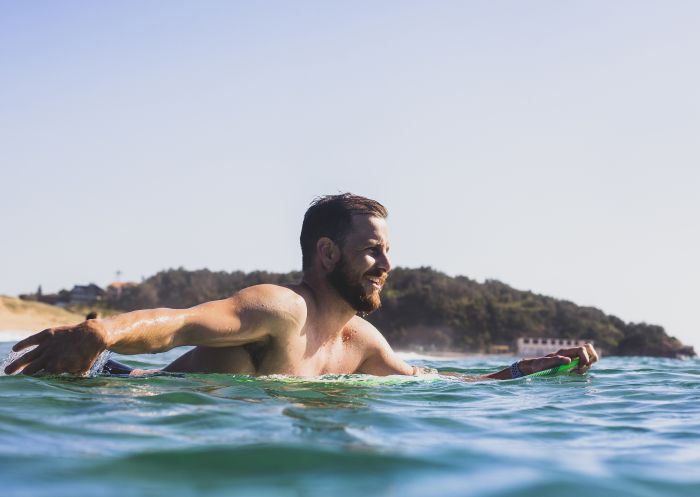 Man enjoying the surf at North Narrabeen Beach, North Narrabeen