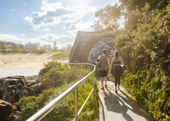 Couple enjoying a coastal walk at Freshwater Beach