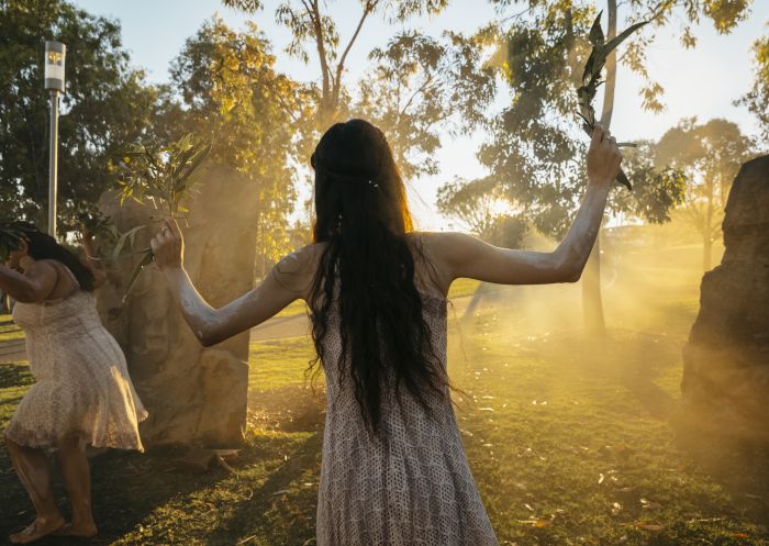 Aboriginal dancers sharing an immersive cultural experience during an Aboriginal Cultural Tour in Barangaroo, Sydney.