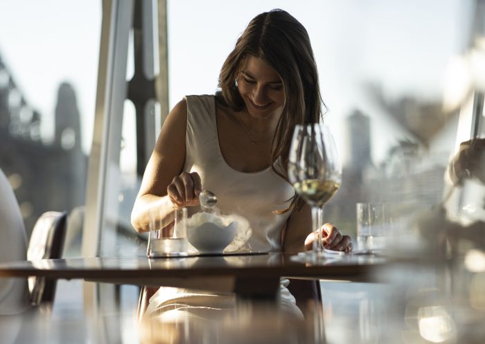 Couple enjoying food and drink at Quay Restaurant, The Rocks