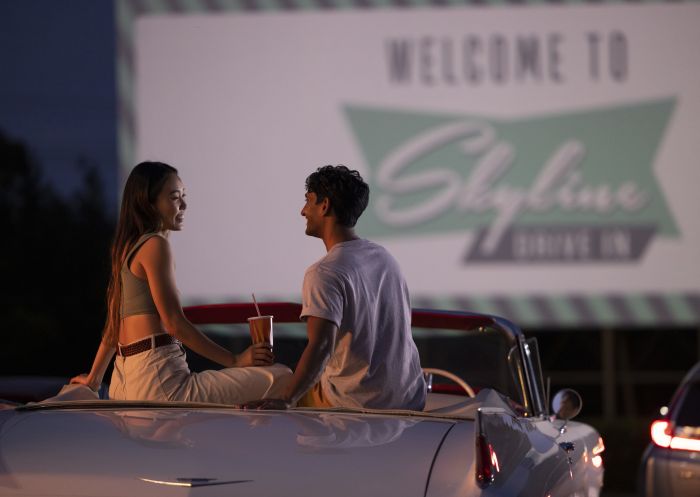 Couple sitting in their car ready to watch a movie at the Skyline Drive In Blacktown