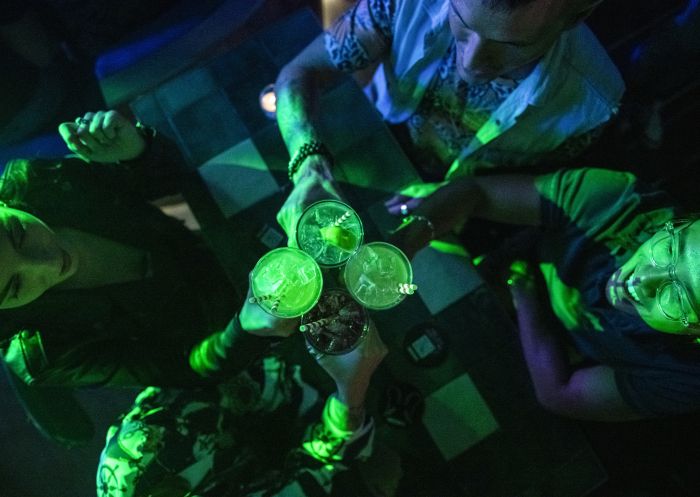 Friends enjoying drinks at Universal Sydney nightclub in Darlinghurst, Sydney