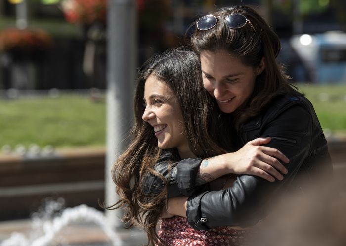 Couple enjoying a walk through Taylor Square in Darlinghurst, Inner Sydney