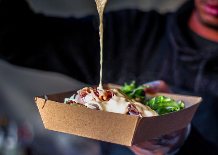 Dripping cheese dish at Bastille Festival in The Rocks, Sydney City