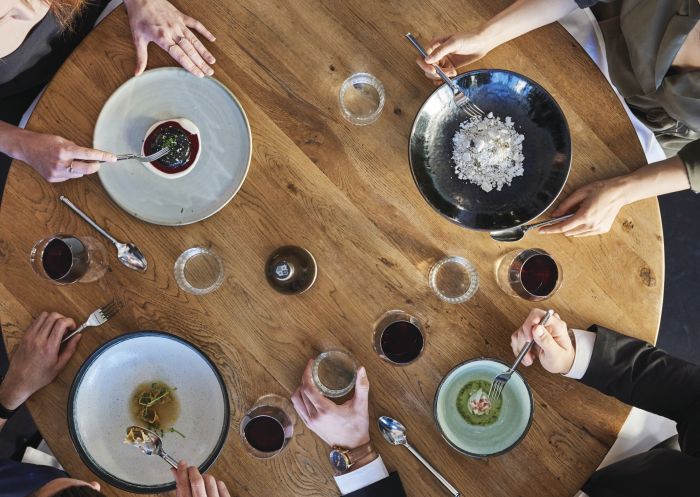 Friends enjoying food and drink at waterside restaurant LuMi Bar & Dining, Pyrmont