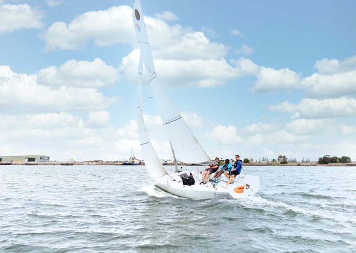 Man learning to sail on Newcastle Harbour, Newcastle 