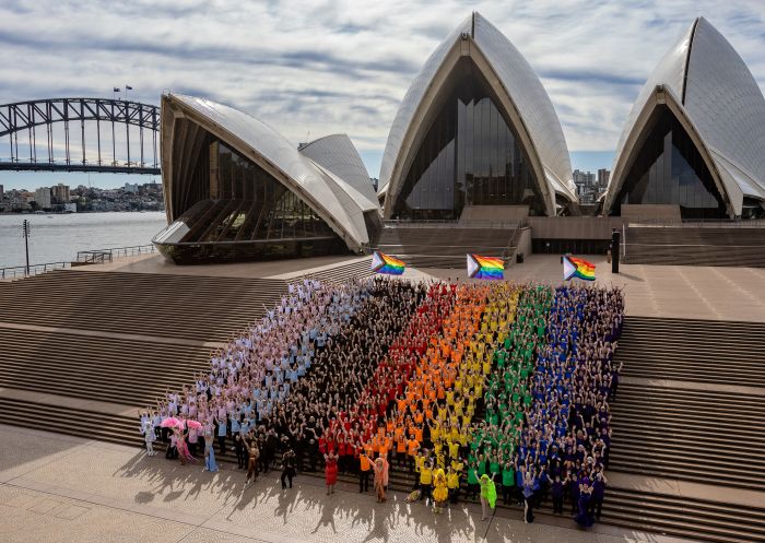 Sydneysiders created a giant human Progress Flag on the steps of the Sydney Opera House to celebrate WorldPride 2022, Sydney